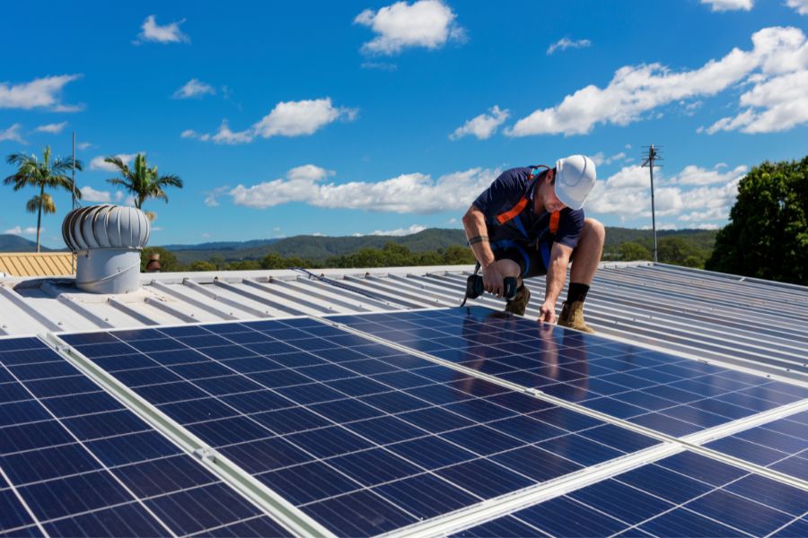 a man installing solar panels